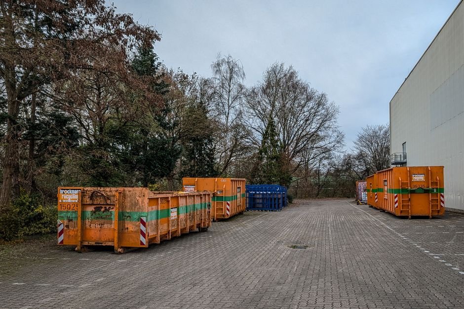 Dumpsters at a commercial work yard